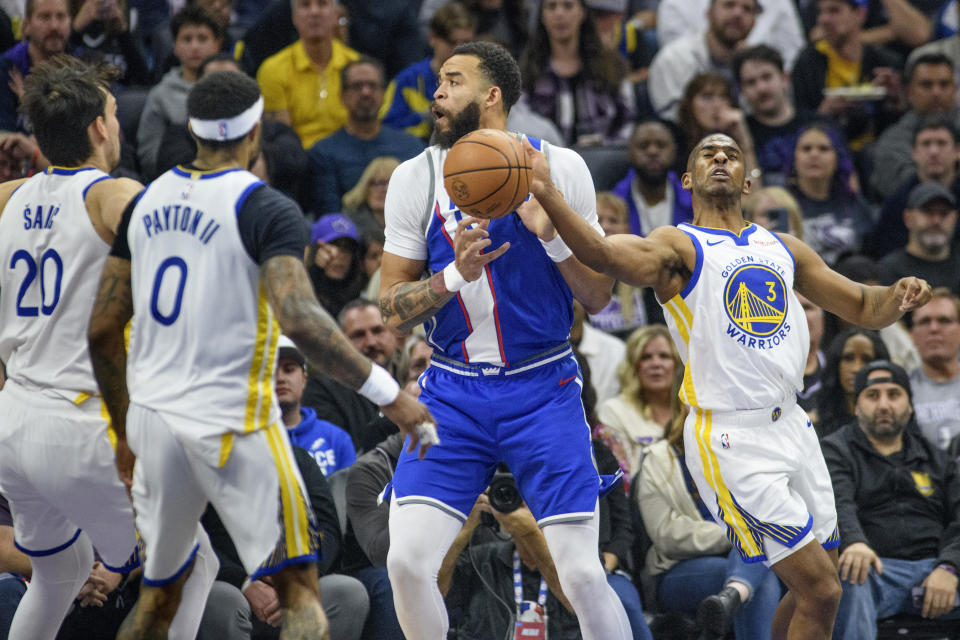 Golden State Warriors guard Chris Paul (3) strips the ball from Sacramento Kings center JaVale McGee during the first quarter of an NBA In-Season Tournament basketball game in Sacramento, Calif., Tuesday, Nov. 28, 2023. (AP Photo/Randall Benton)