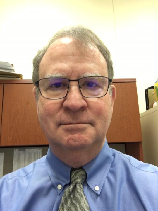 Charles Ballard, economics professor at Michigan State University, prepares to do an online-only class during the coronavirus crisis.