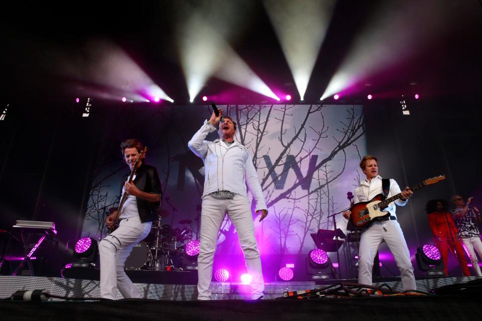 Singer Simon Le Bon, (center) John Taylor, (left) on bass and Andy Taylor on guitar and of Duran Duran as they perform on the Lands End stage during day one of the Outside Lands Music Festival in Golden Gate Park in San Francisco, California, on Fri. Aug. 5, 2016. (Michael Macor/San Francisco Chronicle via AP)