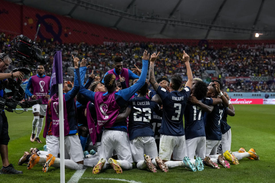 Ecuador's Enner Valencia celebrates with his teammates after scoring his side's first goal during the World Cup group A soccer match between Netherlands and Ecuador, at the Khalifa International Stadium in Doha, Qatar, Friday, Nov. 25, 2022. (AP Photo/Natacha Pisarenko)