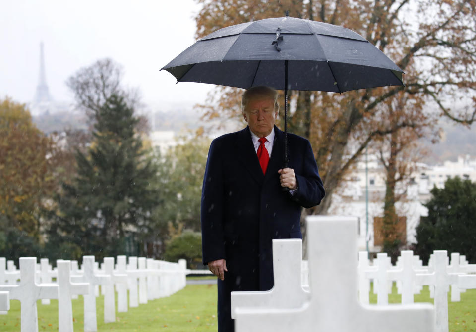 President Donald Trump stands among headstones during an American Commemoration Ceremony on Sunday&nbsp;at Suresnes American Cemetery near Paris, one day after skipping another World War I ceremony because of rain. (Photo: The Associated Press)