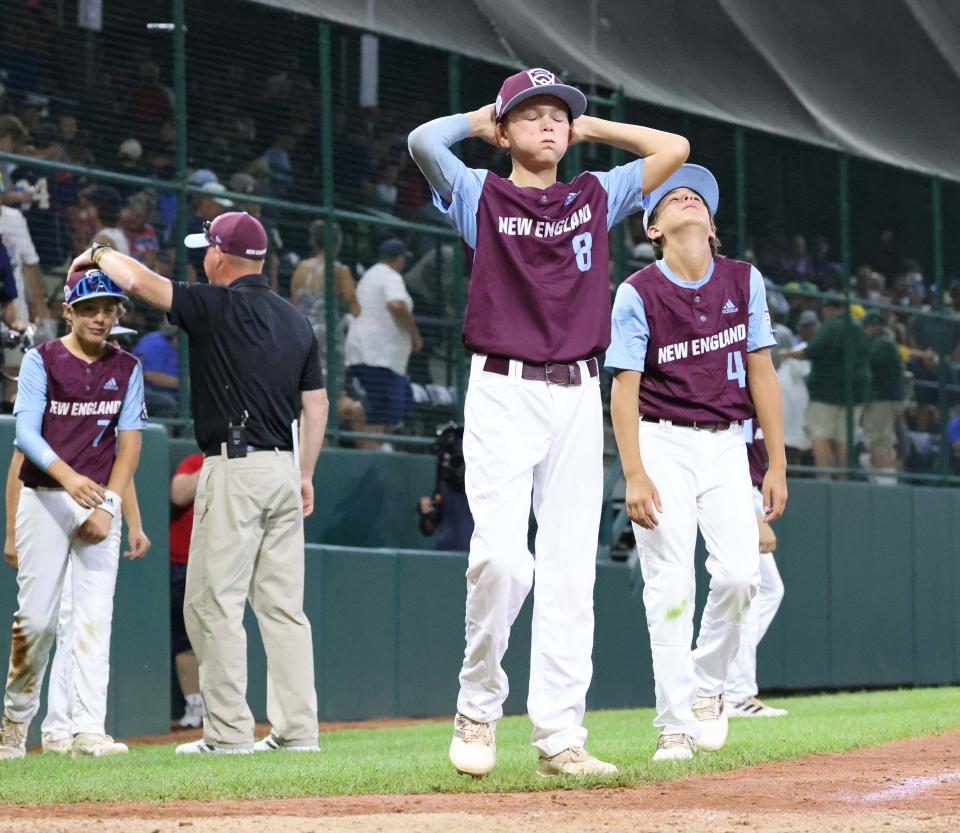Members of the New England Little League champion Middleboro 12u Nationals react at the conclusion of their game against Mid-Atlantic champion Hollidaysburg, Pennsylvania, at Howard J. Lamade Stadium  at the Little League World Series in South Williamsport, Pennsylvania, on Saturday, Aug. 20, 2022.