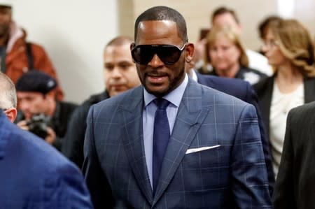 FILE PHOTO: Grammy-winning R&B singer R. Kelly arrives for a child support hearing at a Cook County courthouse in Chicago