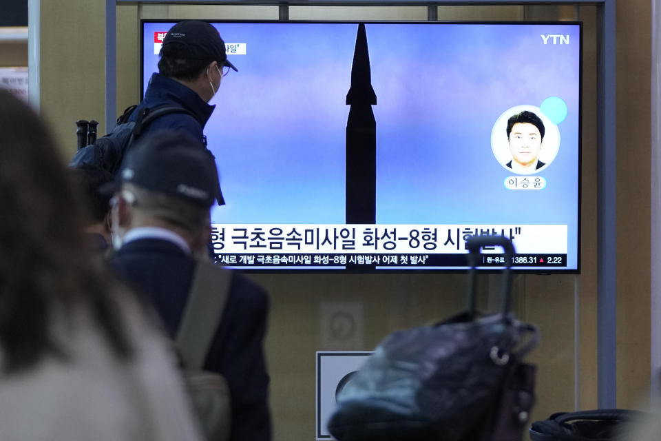 People watch a TV screen showing a news program reporting about North Korea's missile launch at a train station in Seoul, South Korea, Wednesday, Sept. 29, 2021. North Korea said Wednesday it successfully tested a new hypersonic missile it implied was being developed as nuclear capable, as it continues to expand its military capabilities and pressure Washington and Seoul over long-stalled negotiations over its nuclear weapons. The Korean letters read: "Test a new hypersonic missile." (AP Photo/Lee Jin-man)