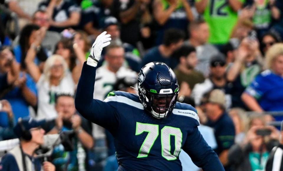 Seattle Seahawks guard Anthony Bradford (70) reacts to a touchdown against the Dallas Cowboys during the second quarter of the preseason game at Lumen Field, Saturday, Aug. 19, 2023, in Seattle, Wash.