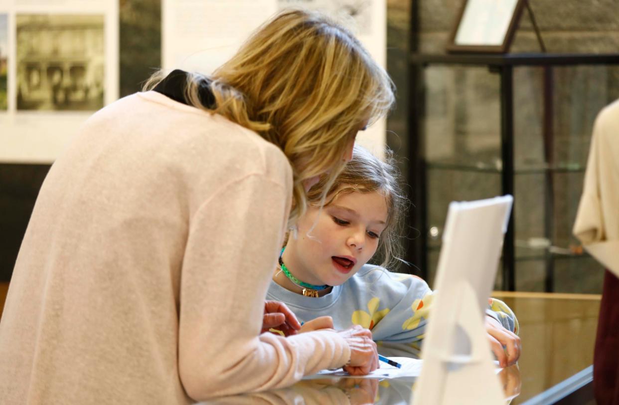 P.J. Logan with grandaughter Lillian Logan during the opening of the Mullins-Taylor Farm exhibit at the Christian County Museum on the Ozark square on April 20, 2024.