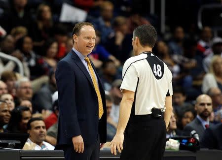 Dec 12, 2015; Atlanta, GA, USA; Atlanta Hawks head coach Mike Budenholzer talks with referee Scott Foster in the first quarter of their game against the San Antonio Spurs at Philips Arena. Mandatory Credit: Jason Getz-USA TODAY Sports