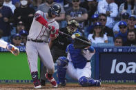 Atlanta Braves' Joc Pederson hits an RBI single in the fourth inning against the Los Angeles Dodgers in Game 3 of baseball's National League Championship Series Tuesday, Oct. 19, 2021, in Los Angeles. (AP Photo/Marcio Jose Sanchez)