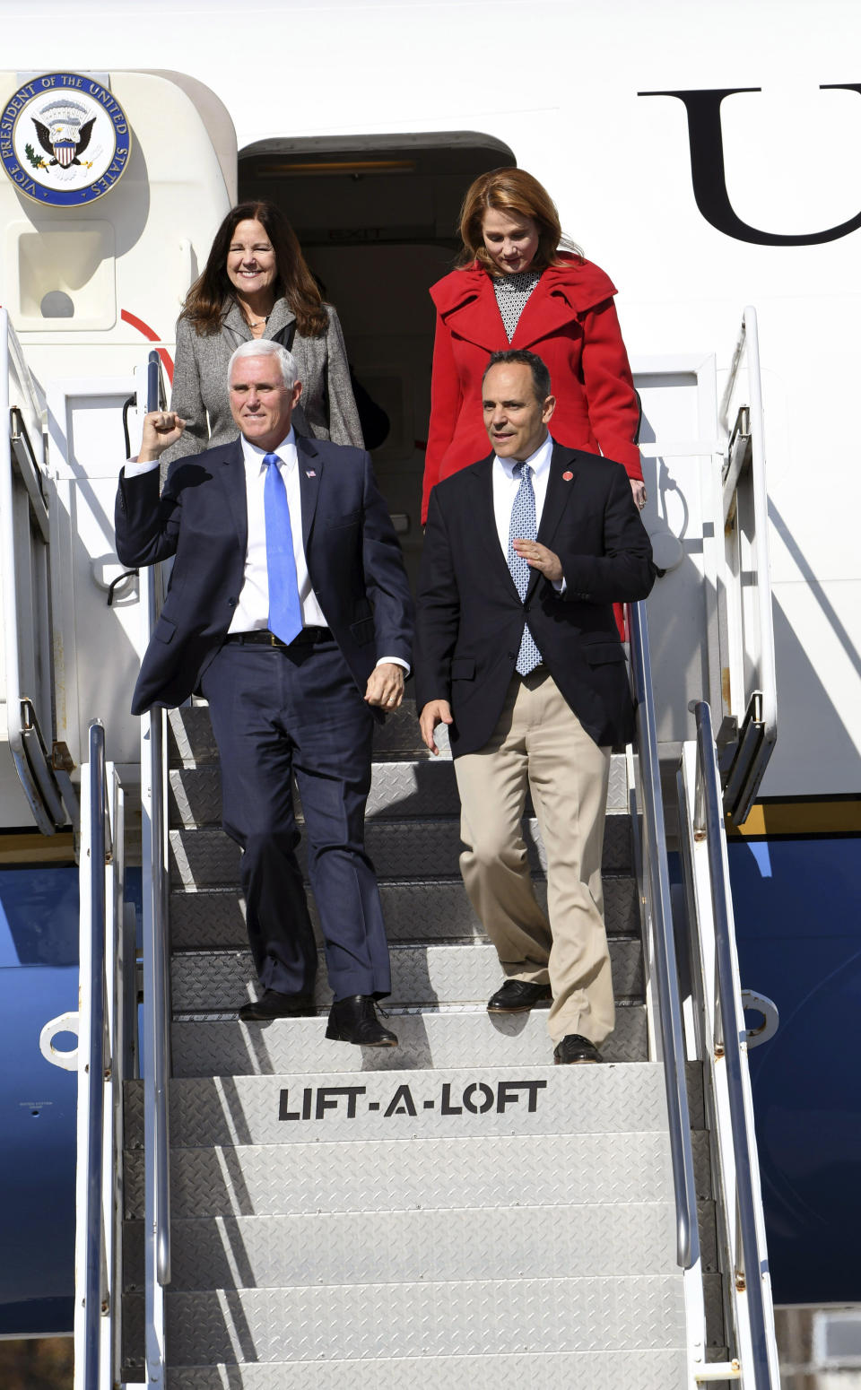 Vice President Mike Pence and Kentucky Gov. Matt Bevin arrive at London-Corbin Airport, Friday, Nov. 1, 2019 in London, Ky. Attempting to turn the Kentucky governor's race into a referendum on impeachment, Vice President Mike Pence urged voters Friday to register their disgust with the "endless investigations" of President Donald Trump by reelecting his close ally, Republican Gov. Matt Bevin.(John Flavell/Lexington Herald-Leader via AP)