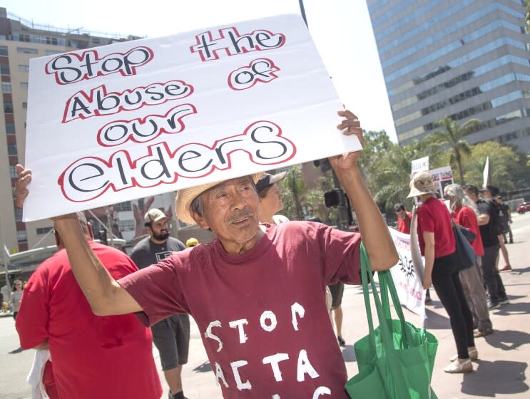 Los Angeles, CA - August 16, 2019 - Tenant Mario Canel, 73, marches through the streets of downtown LA on Friday. to protest the Ellis Act which allows renters to be evicted from rent-controlled apartments if the building is being torn down or removed from the rental market. They say large developers are abusing the Ellis act by evicting tenants with the plan of demolishing or rehabbing rent-controlled apartment buildings to build luxury housing. (Ana Venegas / For The Times))