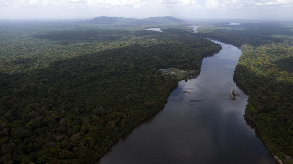 The Essequibo River flows through Kurupukari crossing in Guyana, Saturday, Nov. 19, 2023. Venezuela has long claimed Guyana’s Essequibo region, a territory larger than Greece and rich in oil and minerals. (AP Photo/Juan Pablo Arraez)