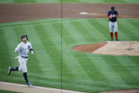 New York Yankees' Aaron Judge, left, runs the bases after hitting a solo home run off Boston Red Sox starting pitcher Zack Godley, right, during the first inning of a baseball game Saturday, Aug. 1, 2020, in New York. (AP Photo/John Minchillo)