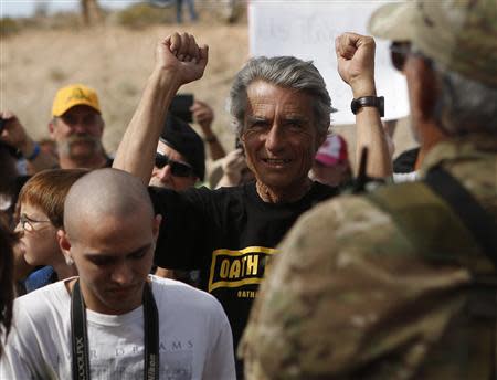 A protester reacts in Bunkerville, Nevada, April 12, 2014. Clark County Sheriff Douglas Gillespie announced the Bureau of Land Management (BLM) was ceasing its cattle roundup operation. Armed U.S. rangers had been rounding up cattle on federal land in Nevada in a rare showdown with Cliven Bundy, a rancher who has illegally grazed his herd on public lands for decades, as conflict over land use simmers in western states. REUTERS/Jim Urquhart