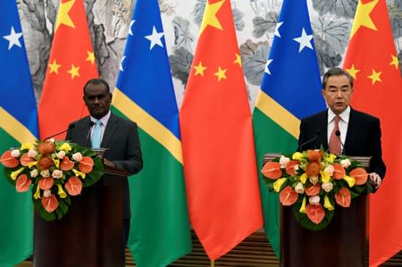 Solomon Islands Foreign Minister Jeremiah Manele and Chinese State Councilor and Foreign Minister Wang Yi hold joint news conference at the Diaoyutai State Guesthouse in Beijing