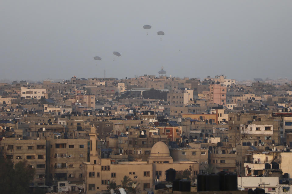 Humanitarian aid is dropped by the United States over Gaza City, Gaza Strip, on Saturday, March 2, 2024. (AP Photo/Mohammed Hajjar)