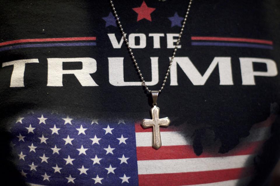 A Christian minister&nbsp;wears a Donald J. Trump-themed shirt with a cross necklace before a 2016 campaign&nbsp;event in Gettysburg, Pennsylvania. (Photo: Mark Makela via Getty Images)