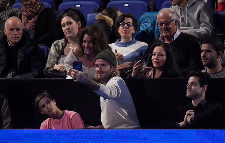 Tennis - ATP World Tour Finals - The O2 Arena, London, Britain - November 19, 2017 David Beckham and son, Romeo Beckham take a selfie during the final between Belgium's David Goffin and Bulgaria's Grigor Dimitrov REUTERS/Toby Melville