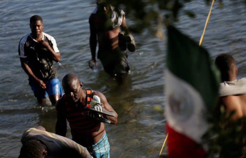 Migrants seeking refuge in the U.S. cross Rio Grande river, in Ciudad Acuna