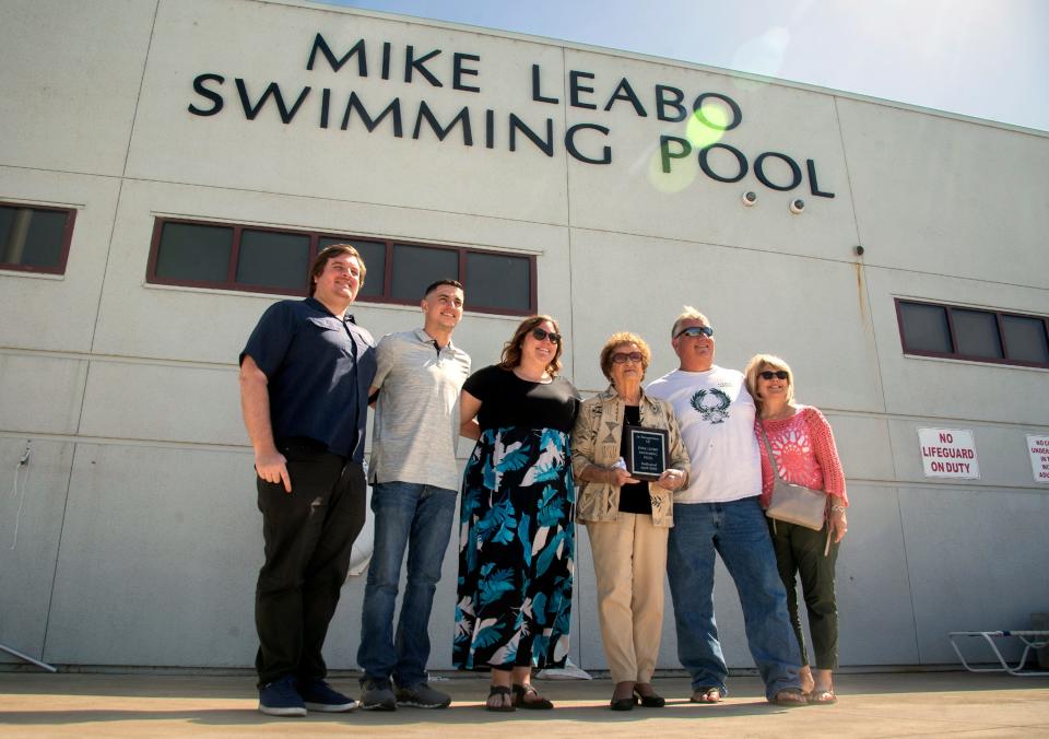 The Lead family, brother-in-law Ryan Leabo, left, son Joey Silbey, daughter Kelli Lewin, mother Vorginias Leabo, brother Brad Leabo and sister-in-law A gala Hayes Leabo pose for a picture during a renaming ceremony at the McNair High School pool in Stockton on Thursday, April  28. 2022. Late water polo coach Mike Leabo died of natural causes on January 13 of natural causes.