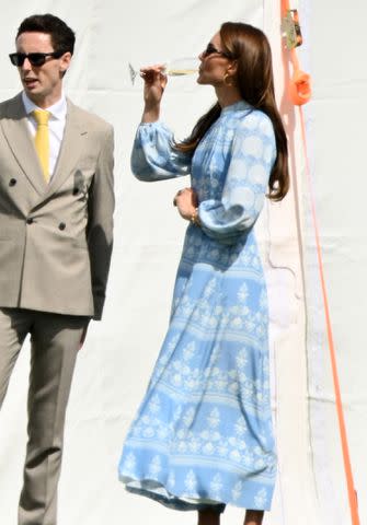 <p>Karwai Tang/WireImage</p> Kate Middleton sips champagne at charity polo match on July 6