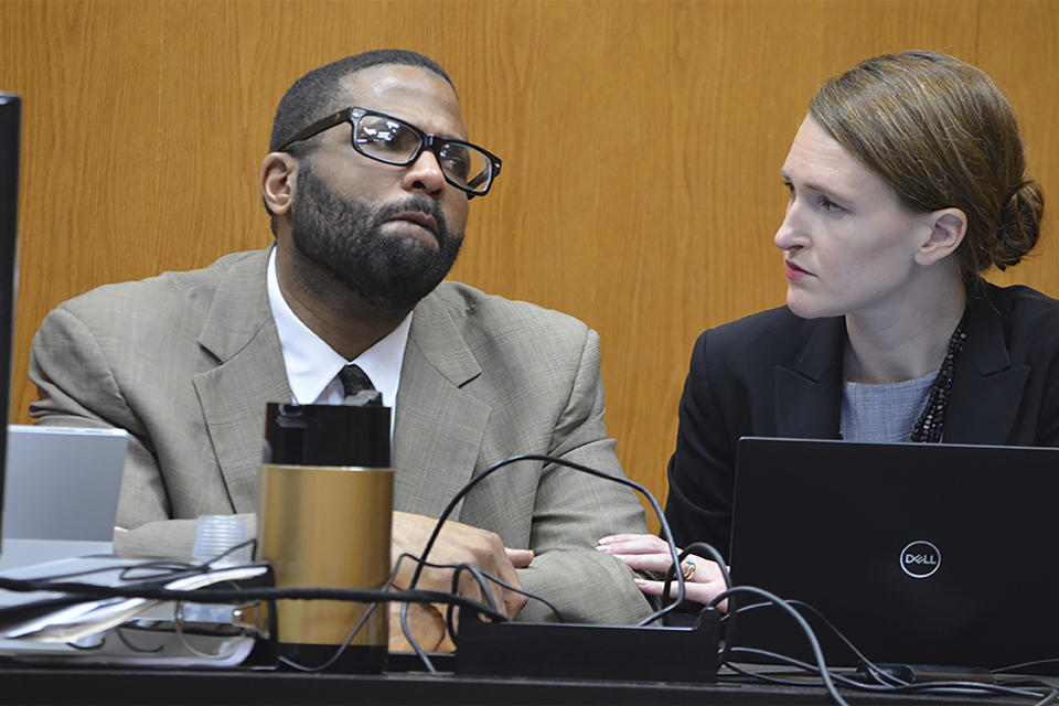 Defense attorney Katherine Poor comforts defendent Willie Cory Godbolt while Godbolt's 12-year-old daughter, My'Khyiah Godbolt, testifies on Monday, Feb. 17, 2020, on the third day of the capital murder trial of Godbolt at the Pike County Courthouse in Magnolia, Miss. Godbolt, 37, is on trial, for the May 2017 shooting deaths of eight people in Brookhaven. (Donna Campbell/The Daily Leader via AP, Pool)