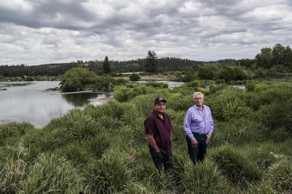 Clayton Dumont, left, and tribal Chairman Don Gentry stand next to the Sprague River