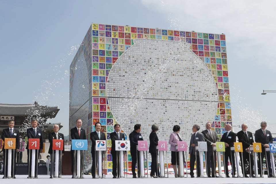 South Korean Prime Minister Chung Sye-kyun, the fifth from left, and other participants attend a ceremony to unveil an installation artwork to commemorate the upcoming 70th anniversary of the Korean War, in Seoul, South Korea, Monday, June 15, 2020. South Korea on Sunday convened an emergency security meeting and urged North Korea to uphold reconciliation agreements, hours after the North threatened to demolish a liaison office and take military action against its rival. (AP Photo/Ahn Young-joon)