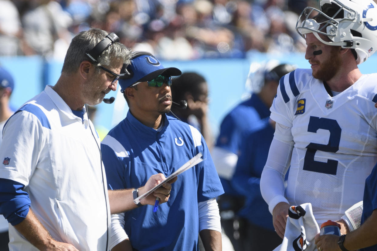 There are plenty of problems with the Colts, and former offensive coordinator Marcus Brady (center) isn't to blame for all of them. (AP Photo/John Amis)