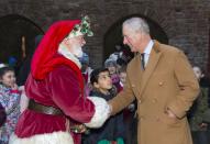 <p>Charles gives Father Christmas a firm handshake during his 2017 visit to Cardiff, Wales.</p>