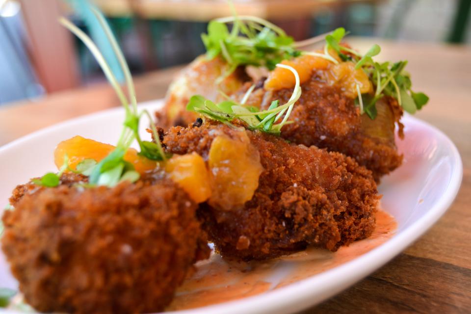 Florida green tomatoes with guajillo aioli and peach jam are served at Farmhouse Kitchen restaurants in Delray Beach and Boca Raton.