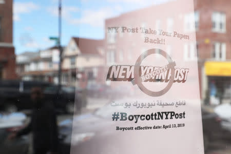 A sign calling for the boycott of the New York Post newspaper is seen in the window of the Yemeni American Merchants Association in the Brooklyn Borough of New York, U.S., April 15, 2019. REUTERS/Shannon Stapleton