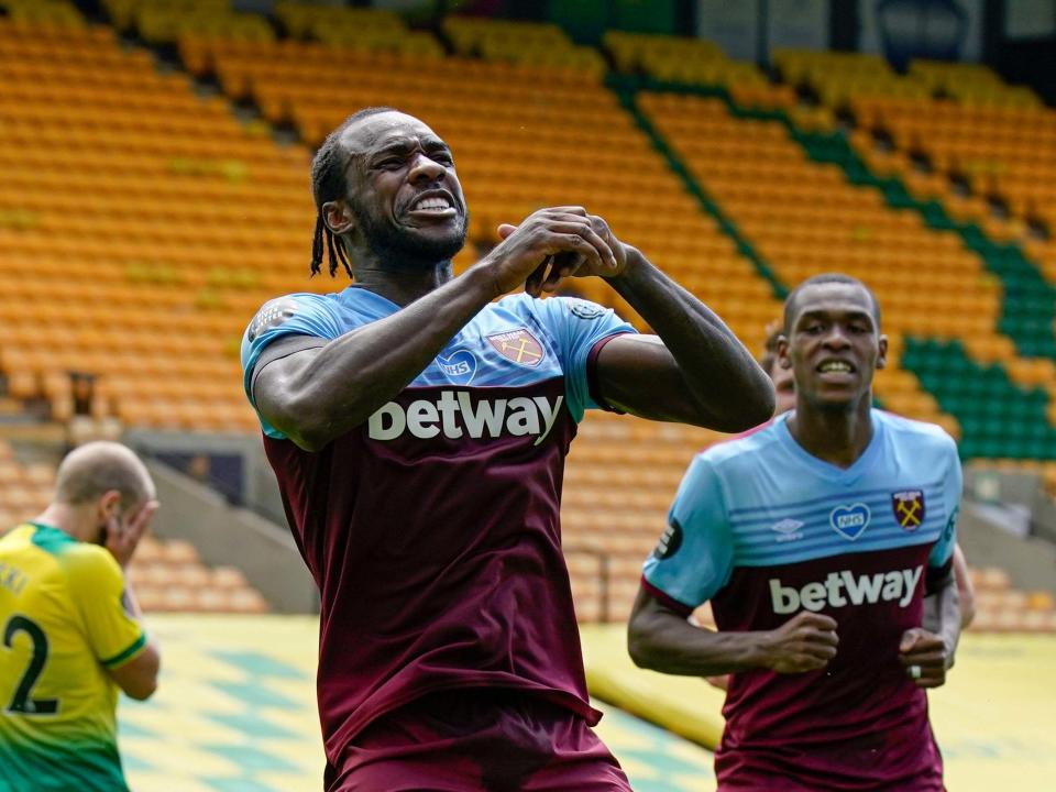 Michail Antonio celebrates scoring one of his four goals that saw West Ham relegate Norwich City: AP