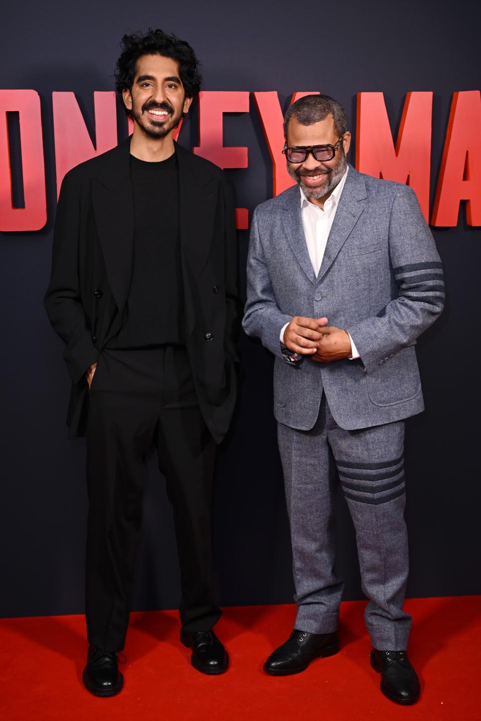 "Monkey Man" producer Jordan Peele, right, with Dev Patel at the London premiere, felt strongly that the movie should be seen in theaters.