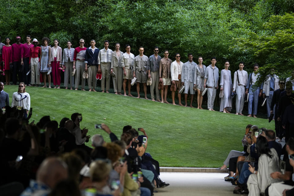 Models wear creations as part of the Giorgio Armani men's Spring Summer 2022 collection, in Milan, Italy, Monday, June 21, 2021. (AP Photo/Luca Bruno)