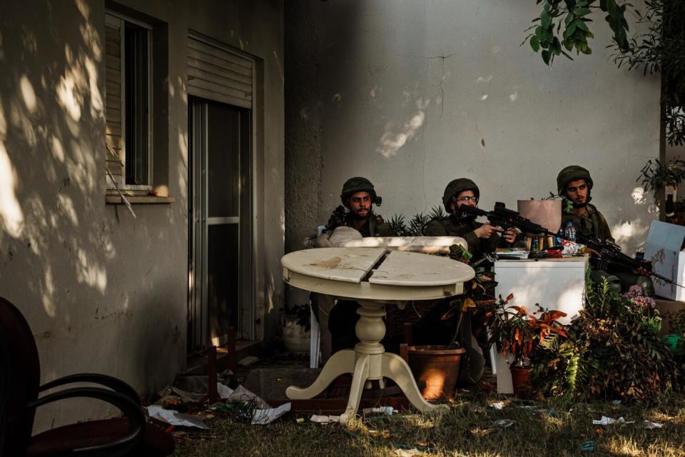 Israeli soldiers stay alert in the aftermath of the Hamas assault in southern Israel.