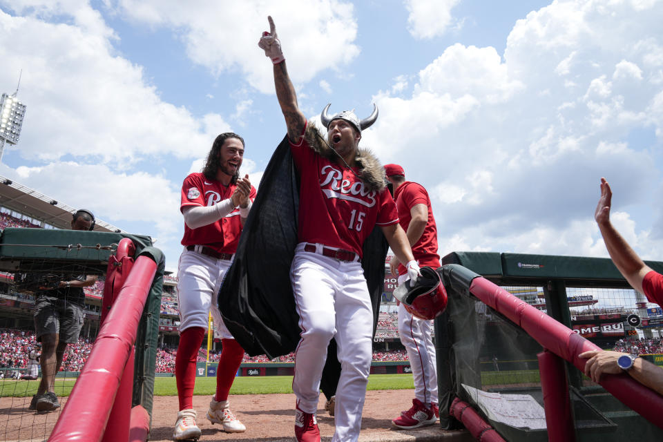 Cincinnati Reds' Nick Senzel (15) reacts as he enters the dugout after hitting a two-run home run against the Arizona Diamondbacks during the second inning of a baseball game, Sunday, July 23, 2023, in Cincinnati. (AP Photo/Jeff Dean)