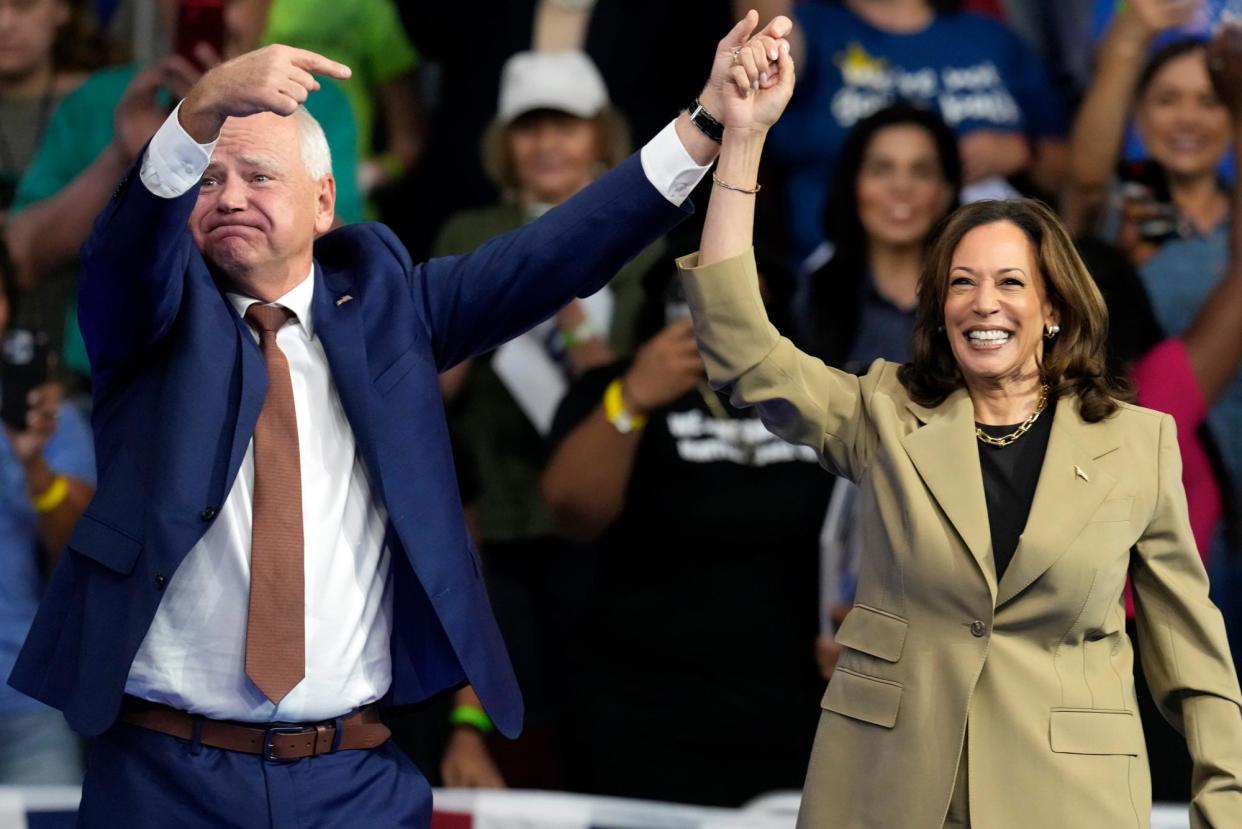 <span>Kamala Harris and Tim Walz arrive at a campaign rally at Desert Diamond Arena on Friday in Glendale, Arizona.</span><span>Photograph: Ross D Franklin/AP</span>