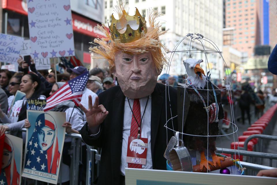 <p>A protester wears a mask of U.S. President Donald Trump at the “I am a Muslim too” rally at Times Square in New York City on Feb. 19, 2017. (Gordon Donovan/Yahoo News) </p>