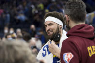 Golden State Warriors' Klay Thompson talks to players after an NBA basketball game against the Cleveland Cavaliers in San Francisco, Sunday, Jan. 9, 2022. (AP Photo/John Hefti)