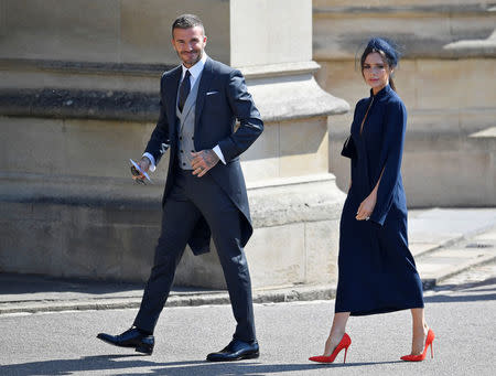 David y Victoria Beckham llegan a la ceremonia de matrimonio del príncipe Enrique, duque de Sussex, y la actriz estadounidense Meghan Markle en la capilla del castillo de Windsor, en Windsor, Reino Unido, 19 de mayo de 2018. REUTERS/Toby Melville/Pool