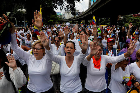 Venezuelan opposition leader Maria Corina Machado (C) attends a women's march to protest against President Nicolas Maduro's government in Caracas, Venezuela, May 6, 2017. REUTERS/Carlos Garcia Rawlins