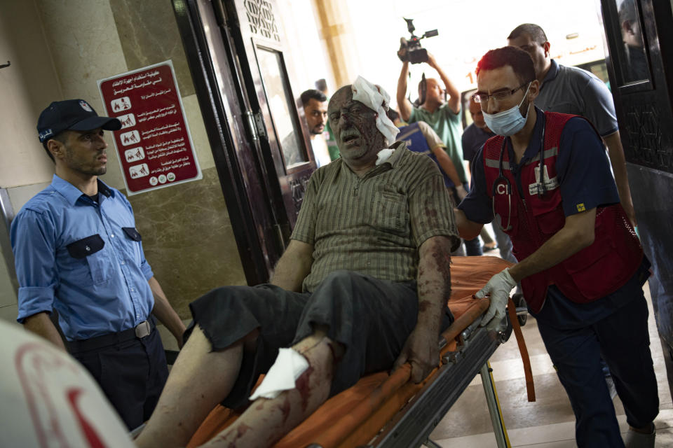 A wounded Palestinian man is wheeled into the Nasser Medical Complex, following Israeli airstrikes on the town of Khan Younis, southern Gaza Strip, Wednesday, Oct. 25, 2023. (AP Photo/Fatima Shbair)