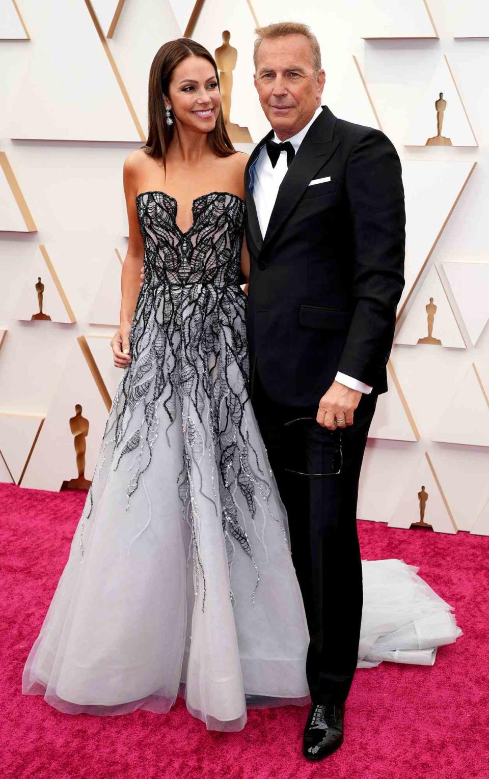 Christine Baumgartner and Kevin Costner attend the 94th Annual Academy Awards at Hollywood and Highland on March 27, 2022 in Hollywood, California