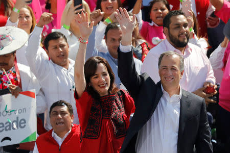 Jose Antonio Meade and his wife Juana Cuevas gesture after Meade was nominated as presidential candidate of the ruling Institutional Revolutionary Party (PRI) at Foro Sol in Mexico City, Mexico February 18, 2018. REUTERS/Carlos Jasso