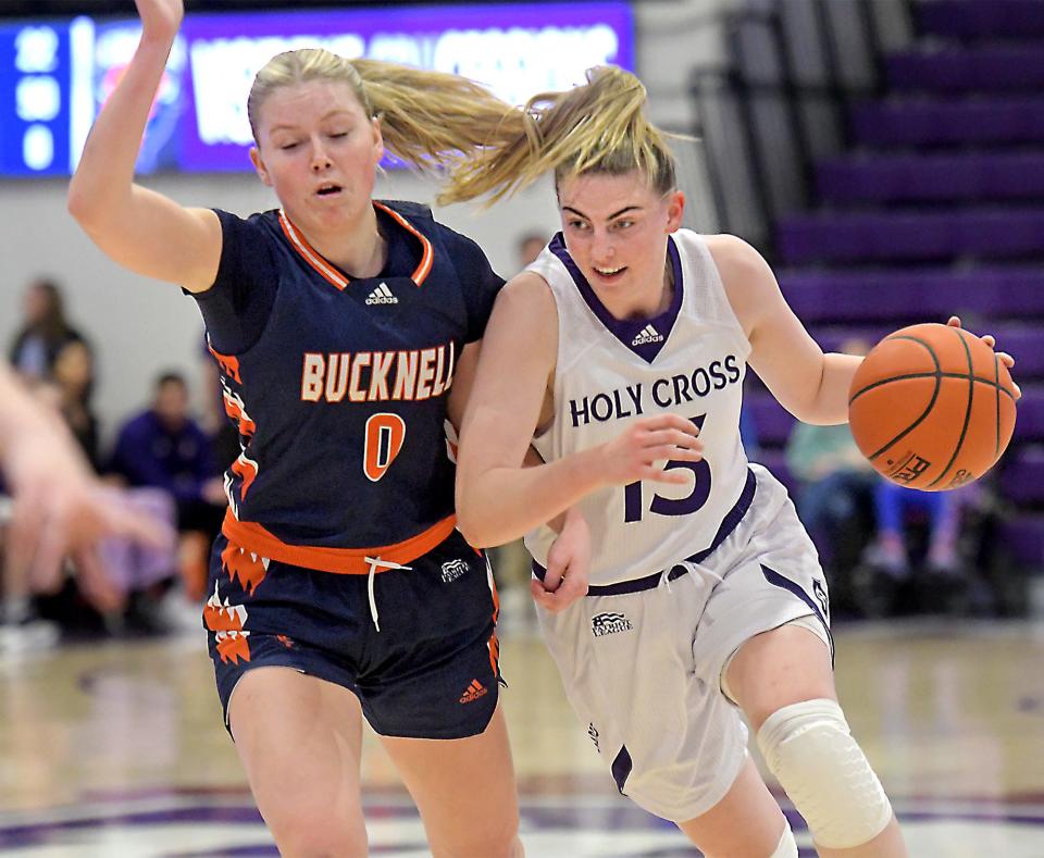 Holy Cross' Bronagh Power-Cassidy drives to the hoop on Bucknell's Emma Theodorsson.