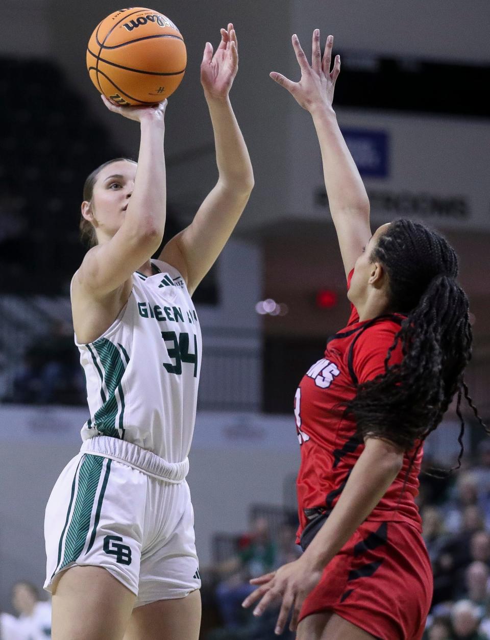 UWGB's Maddy Schreiber (34) shoots a 3-pointer against Youngstown State during the quarterfinals of the Horizon League tournament Thursday at the Kress Center in Green Bay.
