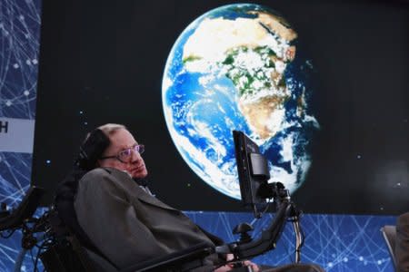 FILE PHOTO: Physicist Stephen Hawking sits on stage during an announcement of the Breakthrough Starshot initiative with investor Yuri Milner in New York April 12, 2016. REUTERS/Lucas Jackson/File Photo