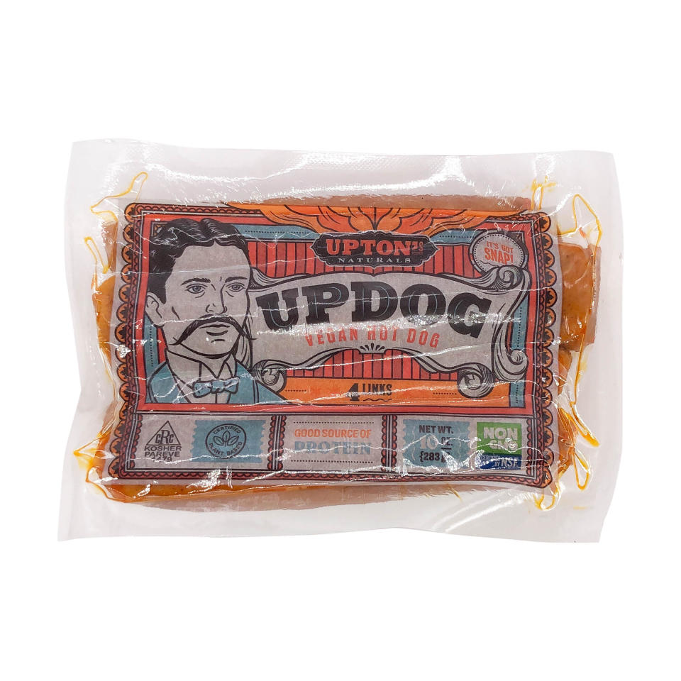 Package of Upton's Naturals Updog vegan hot dogs showing an illustrated man with a mustache and nutritional information stating "Good Source of Protein"