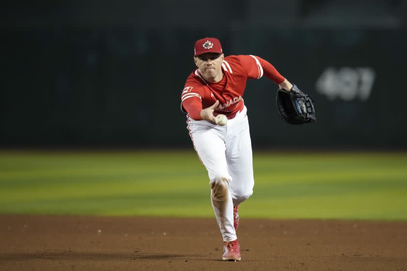 Canada first baseman Freddie Freeman throws to first for an out against Great Britain during the sixth inning of a World Baseball Classic game in Phoenix, Sunday, March 12, 2023. (AP Photo/Godofredo A. Vásquez)