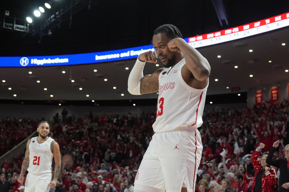Houston's J'Wan Roberts (13) reacts after making a basket while being fouled by Texas during the second half of an NCAA college basketball game Saturday, Feb. 17, 2024, in Houston. Houston won 82-61. (AP Photo/David J. Phillip)